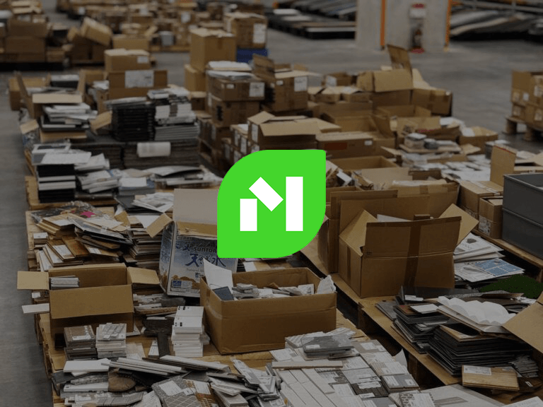 Aerial view of a beach with turquoise water and green cliffs